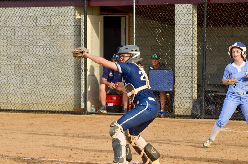 Seahawks senior Delainie Monitzer squeezes a relay throw to the plate.