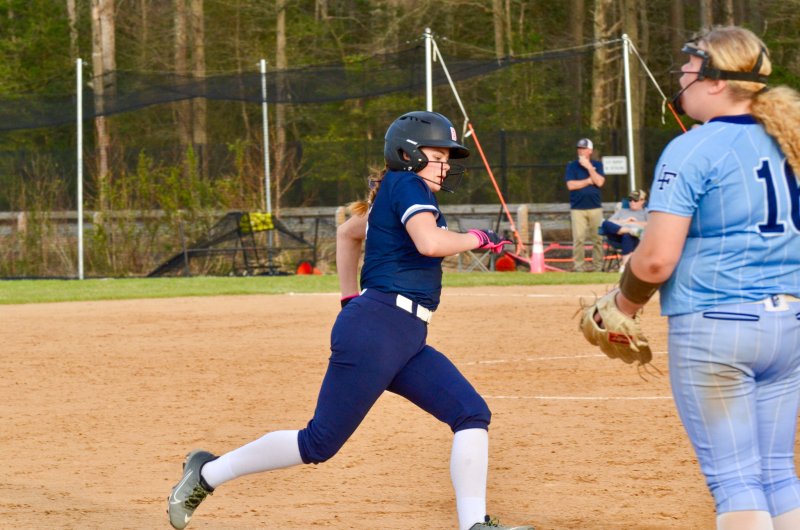 Sussex Academy eighth-grader Bailey LeCates rounds third base.