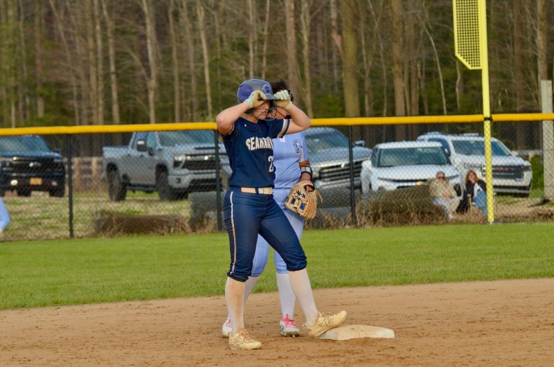 Sussex Academy senior Delainie Monitzer stands on second after driving in a run.