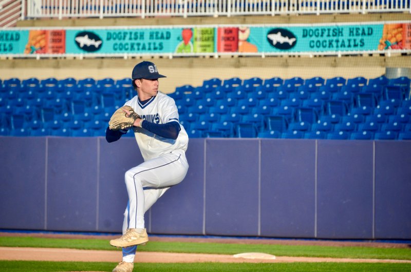 Sussex Academy senior Victor Goodhue begins to swing his leg toward home.