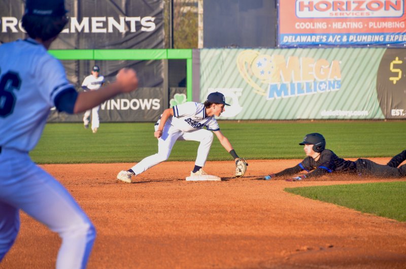 Sussex Academy sophomore Ben Tollett applies the tag after classmate Mason Glover threw a dart to second base to end the top of the first inning.