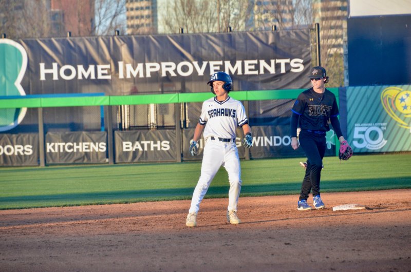 Sussex Academy junior Cole Bunting rounds second base on his double to left field.