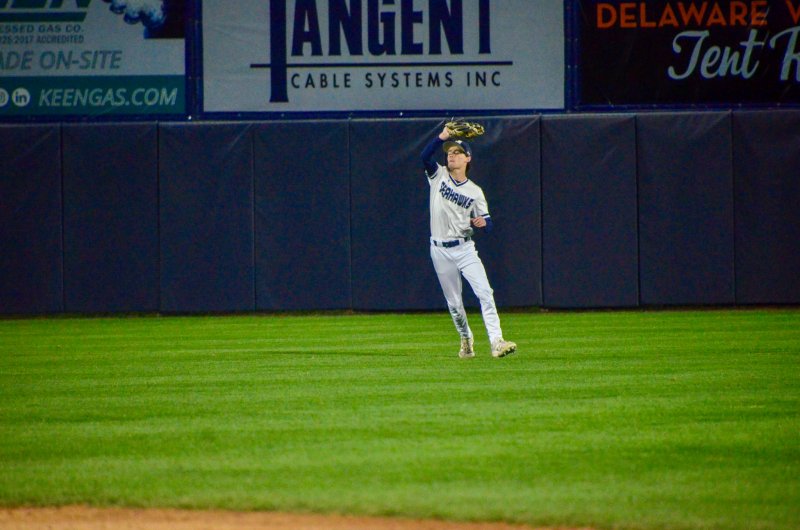 Sussex Academy sophomore Alex Stanislav hauls in a fly ball in center field.