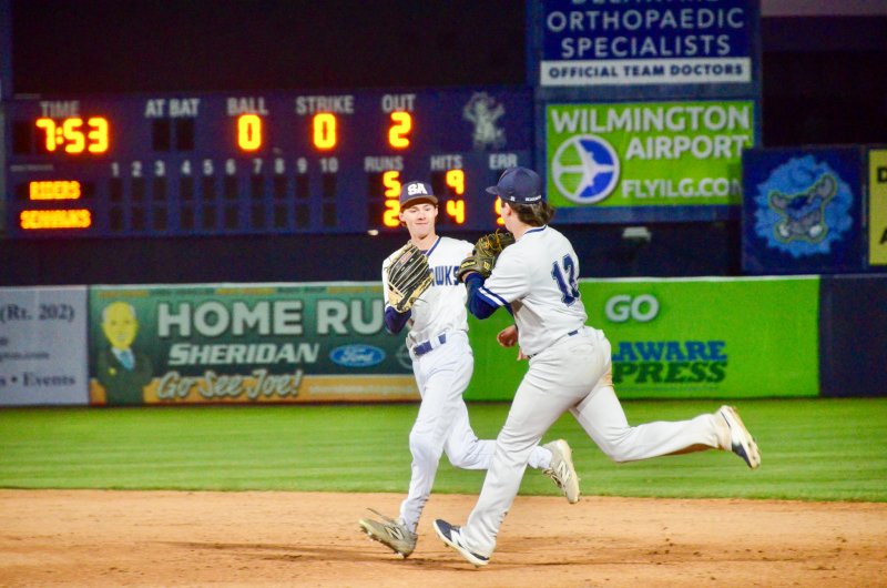 Seahawks junior Derek Sachs, right, gets props from Alex Stanislav after making a great play in right field to take away a hit and save some runs.