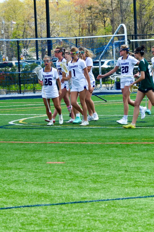 Sussex Academy sophomore Brooklyn Montgomery leads her team back to their draw positions after scoring.