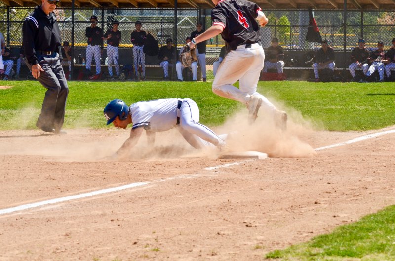 Seahawks senior Victor Goodhue slides into third base.