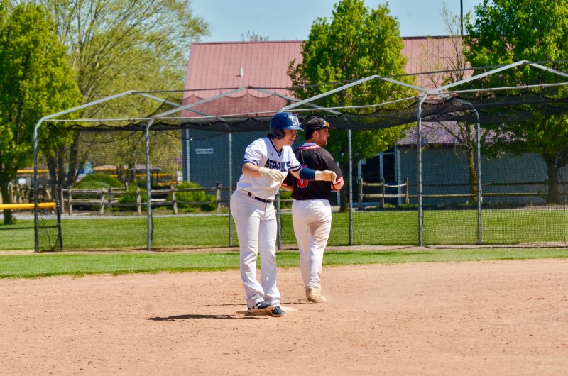Sussex Academy junior Derek Sachs stands on second base after driving in a run.