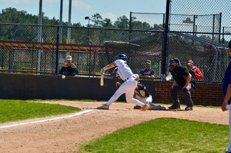 Seahawks sophomore Mason Glover throws his bat into the zone.