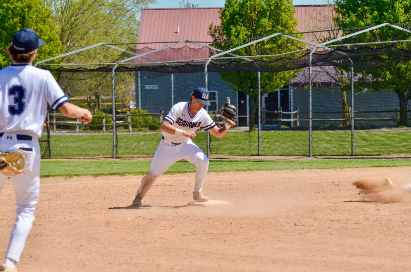 Sussex Academy senior Victor Goodhue stomps on second base for an out.