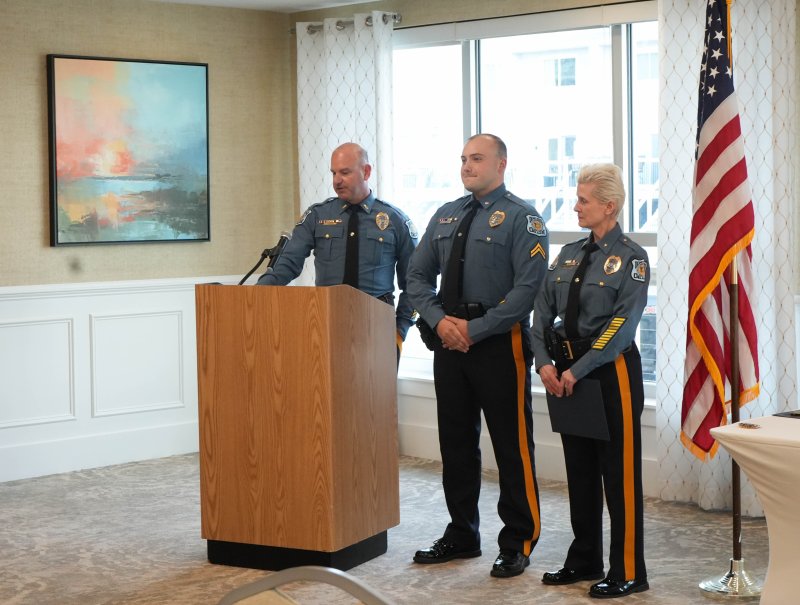 Lt. Cliff Dempsey, left, promotes Dylan Ebke, middle, from corporal to staff corporal. On the right is Chief Constance Speake.