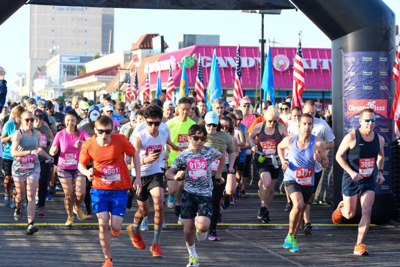 Rehoboth-area streets, roads and trails will be crowded with runners April 12 for the Coastal Delaware Running Festival 9K, half-marathon and full marathon events. This photo shows the start of the 2023 CoDel 9K race on the Rehoboth Beach Boardwalk. DAVE FREDERICK PHOTO