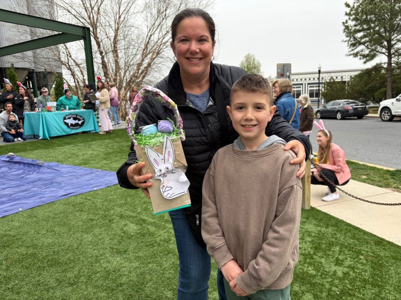 Sara Brady and her nephew, Ben Hawrylak, get ready to head to the top of the Steampunk Treehouse to drop their eggs as part of Dogfish Head’s April 2 Egg Drop in Milton.