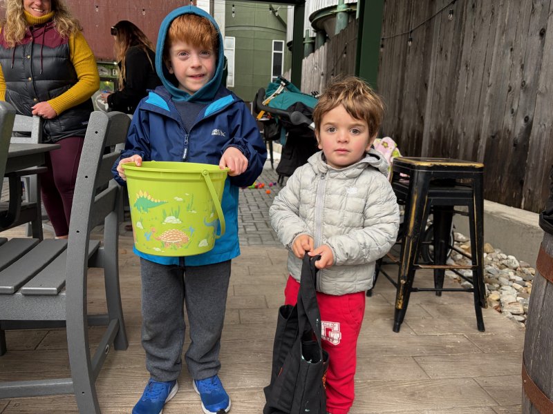 Sawyer Shannon, left, and his brother Cooper show off their prizes from the egg hunt.