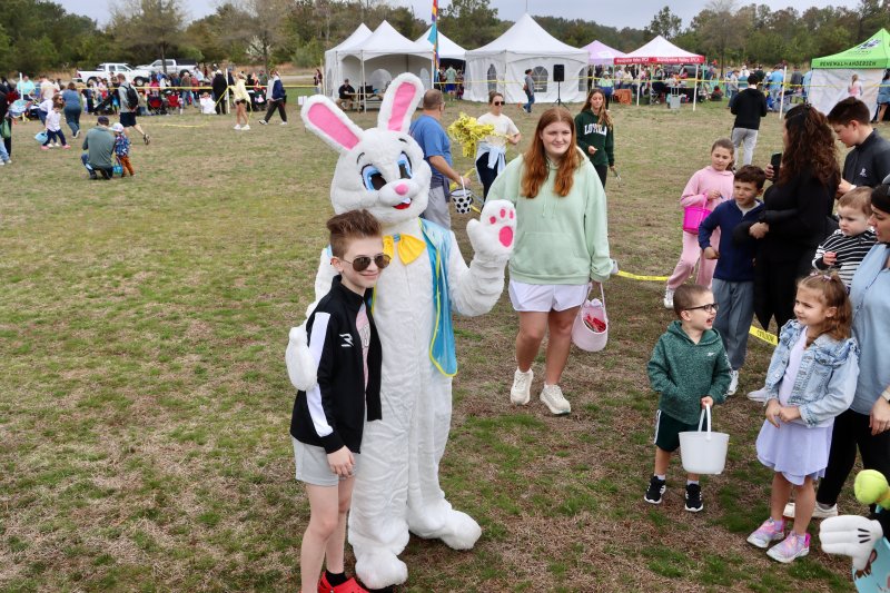 William Cook from Camden-Wyoming poses with the Easter bunny at the kite festival.