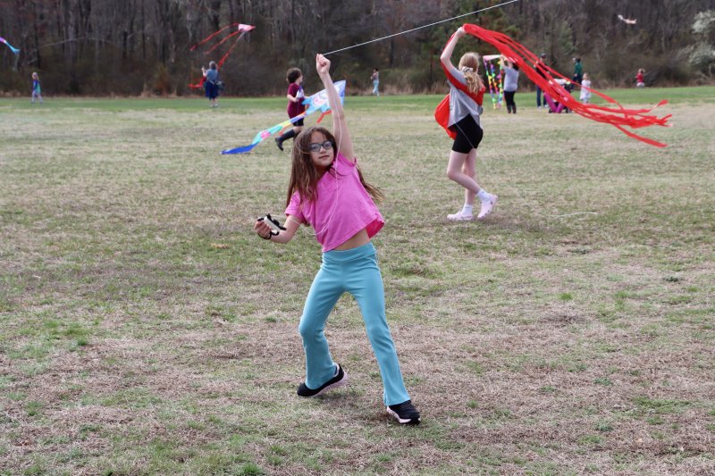 Addison Rogsan from Millsboro works hard to keep her kite in the air.