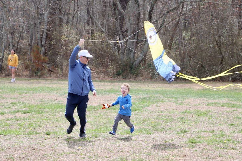 John and Johnny Matarese from Newark have a blast getting their Minion kite into the air.