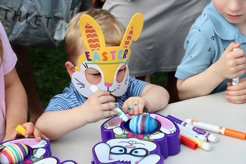 Hudson Robin from Chadds Ford, Pa. is decked out in a bunny mask to color Easter Eggs.