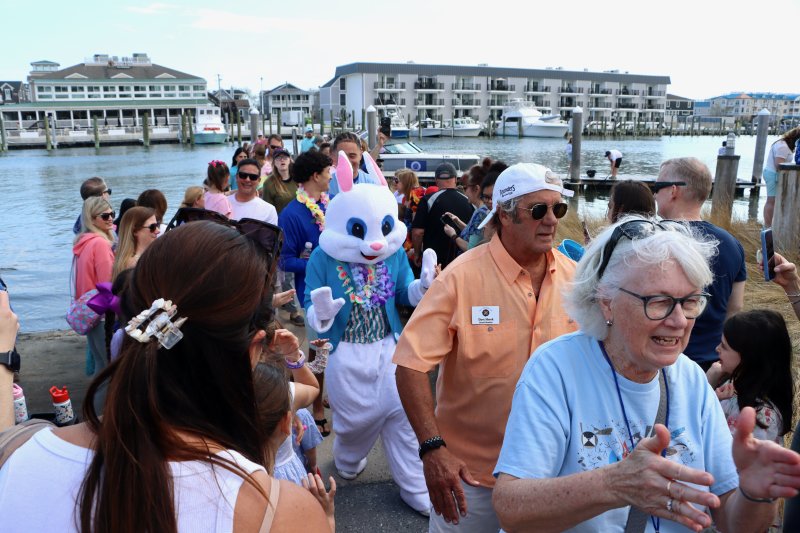 The Easter Bunny makes his way through throngs of fans on his way from the dock in Canalfront Park.