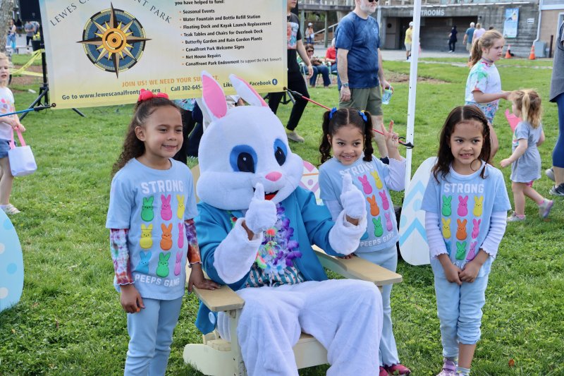 The Easter Bunny poses for a photo with three of his fans. Shown are (l-r) Mia Zouyon, Lorna Vernon and Claire Vernon. BILL SHULL PHOTOS