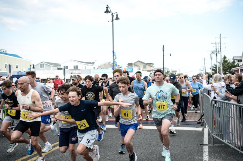 The field of runners in the Bunny Palooza 5K takes off along Garfield Avenue.