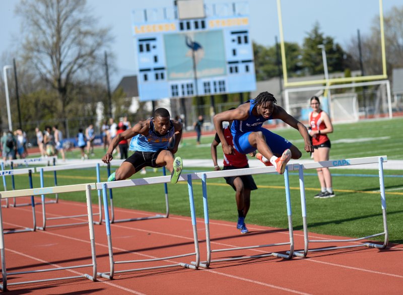 Marc Patterson of Dover edges Elijah Shockley-Taylor of Cape in the hurdles. DAVE FREDERICK PHOTOS