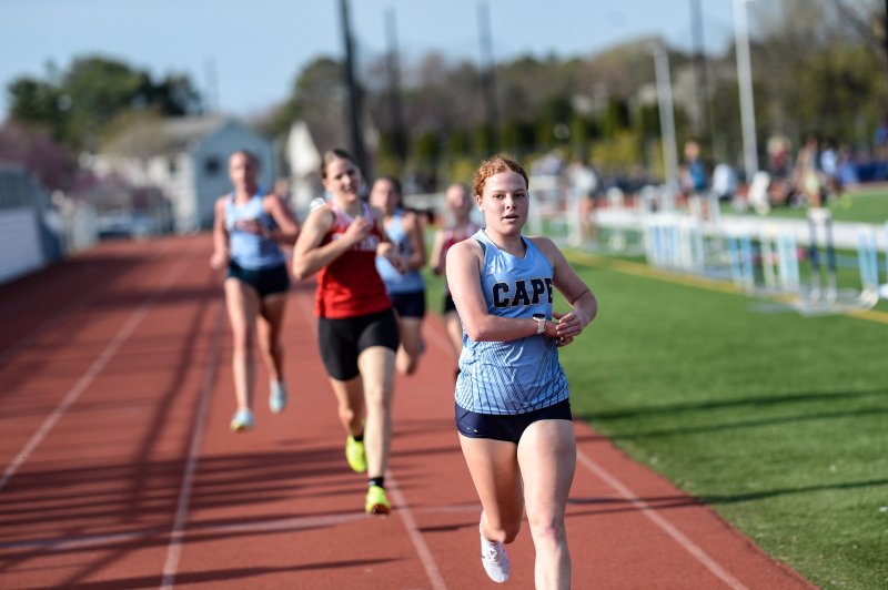 Cape’s Logan Crotty runs a personal-best time of 5:44 to win the 1,600.