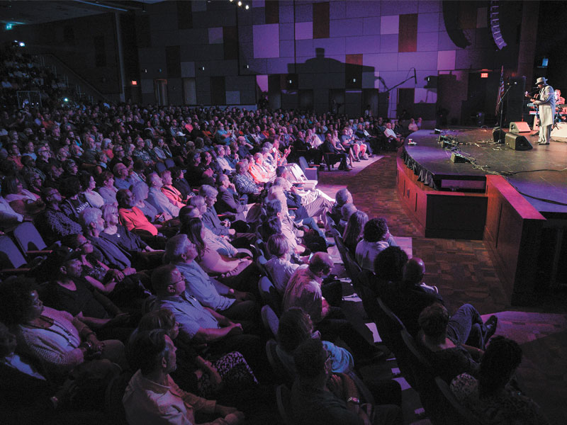 A packed house listens to Nick Colionne at Cape Henlopen High School.