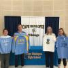 Students pose with donated apparel