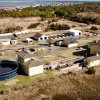 An aerial view of the current Lewes wastewater treatment plant on American Legion Road. The Board of Public Works has completed a draft agreement with Sussex County on a new plant. If approved, wastewater will be pumped from two pump stations to the county’s Wolfe Neck facility, which is being upgraded. The current plant will be decommissioned and the land returned to Greenfields conditions. NICK ROTH PHOTO