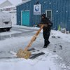 No shovel, no problem for Tim Gregg, who made his own to clean off the parking lot of his business in Rehoboth Beach on Feb. 22. BILL SHULL PHOTO