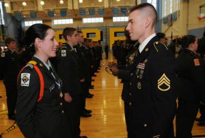 Cape JROTC Cadet Hannah Morley, left, is inspected by Sgt. Lee Vandelochet during the JROTC cadet comprehensive inspection. Vandelochet recently returned from a deployment in Afghanistan. BY DAN COOK