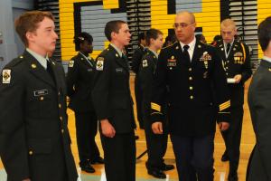 Sgt. First Class John Bolles, facing the camera, inspects the lineup of Cape cadets during the comprehensive inspection. BY DAN COOK