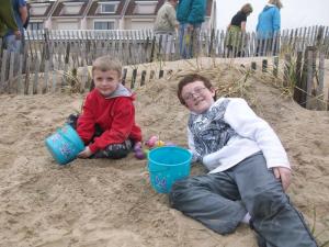 Nolan, left, and Henry Witman receive half off one week of skim camp for finding the only golden egg in the hunt. BY KARA NUZBACK