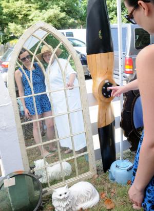 Gabby Nadig of Lewes and her mother Paula look for antique mirrors from "Country Treasures Antiques" for a home makeover they are completing.