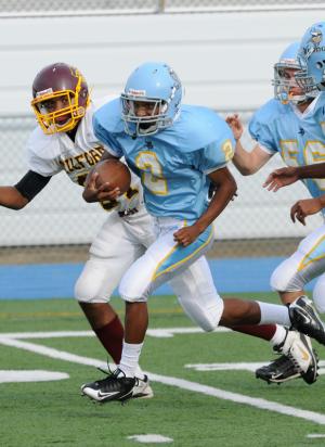 Cape sophomore Tyreik Burton breaks through the Milford defense and runs for a long touchdown in the 30-8 win over the Bucs' junior varsity. BY DAN COOK