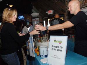 What would a brunch be without Bloody Marys? Shown serving up a Bloody Mary to Jill Mahon, left, is Henlopen City Oyster House co-owner Joe Baker. BY STEVEN BILLUPS