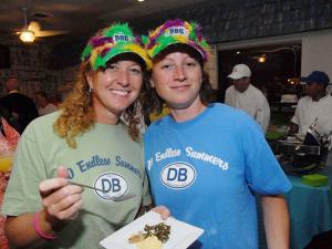 Getting away from their Gary’s Dewey Beach Grill table and enjoying other gourmet foods are Katie Avsec, sushi chef and owner, left, and Holly Ski, chef owner. BY STEVEN BILLUPS