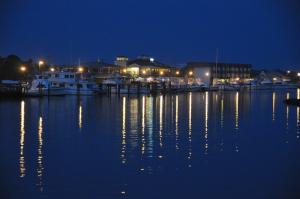 Lights are reflected in long lines on the surface of the Lewes-Rehoboth Canal, completed in 1927 by the U.S. Army Corps of Engineers. The canal, part of the Atlantic inter-coastal waterway, links Rehoboth and Delaware bays. BY RON MACARTHUR