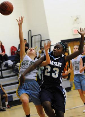 Beacon guard Riley Shields gets fouled going to the basket. BY DAN COOK