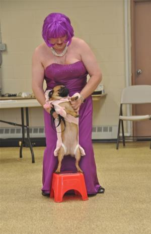Andy "Sweet Candy" Jones has a little trouble getting his dog to do tricks as the duo compete in the Miss Swamp Rat Pageant. BY RON MACARTHUR