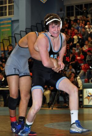 Cape sophomore Austin Smith tries to escape Sussex Tech's Nick Bennett in a 126-pound bout. BY NICK ROTH