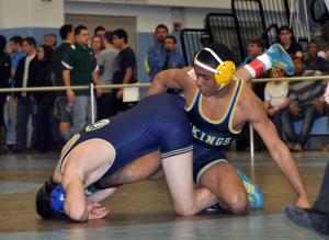 Cape sophomore Justin Lopez tries to gain control against his opponent in a 145-pound match. BY NICK ROTH