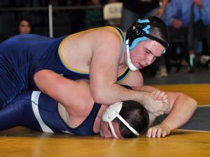 Cape's Thomas Ott battles Lake Forest's Marshall Hobbs in the state finals of the 220-pound weight class. BY NICK ROTH
