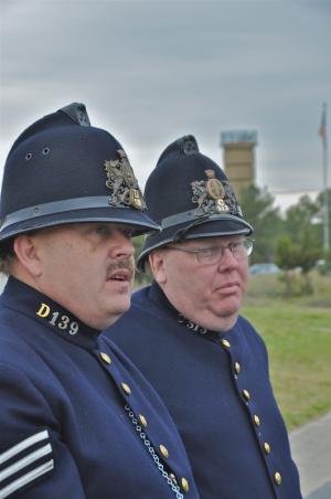 In a first for Fort Miles events, a pair of London police re-enactors discuss the role of the police during World War II. They are Bill Bethke, left, and Alastair Lyons, both of Frederick, Md. BY RON MACARTHUR