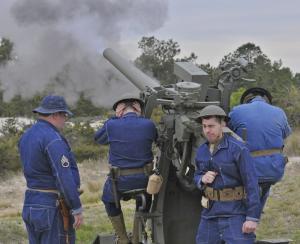Re-enactors put on an artillery-firing demonstration for spectators at Fort Miles. The 3-inch, 50-caliber guns are 100 years old. Four were in place at the tip of Cape Henlopen point in Fort Miles during World War II. BY RON MACARTHUR