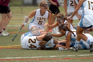 A pile of smiles marked a spontaneous celebration after Sara Young scored the game-winning goal against Severn. BY DAVE FREDERICK