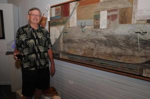 Jurors Excellence Award recipient Gary Crowl stands next to his driftwood work titled “Docked #247.” BY STEVEN BILLUPS