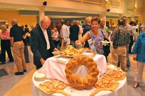Foundation member Touch of Italy's breads, dishes and desserts fill tables in the Cape High School cafeteria. BY RON MACARTHUR