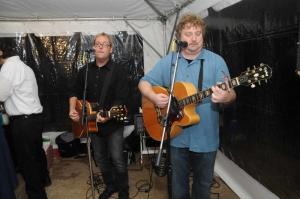 Love Seed Mama Jump members Cliff Hillis, left and Pete Wiedmann play an acoustic set before taking the stage after dinner. BY STEVEN BILLUPS