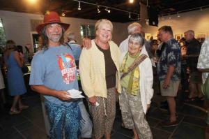 Having fun at the opening are (l-r) Guillermo Silveira, Lynn Wilson and Aina Nergaard-Nammack. BY STEVEN BILLUPS